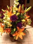 orange lilies and purple carnations