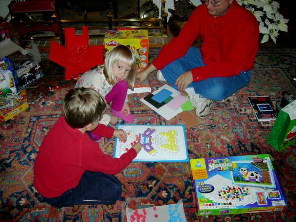 Cameron and Stephanie playing with the magnetic mosaics