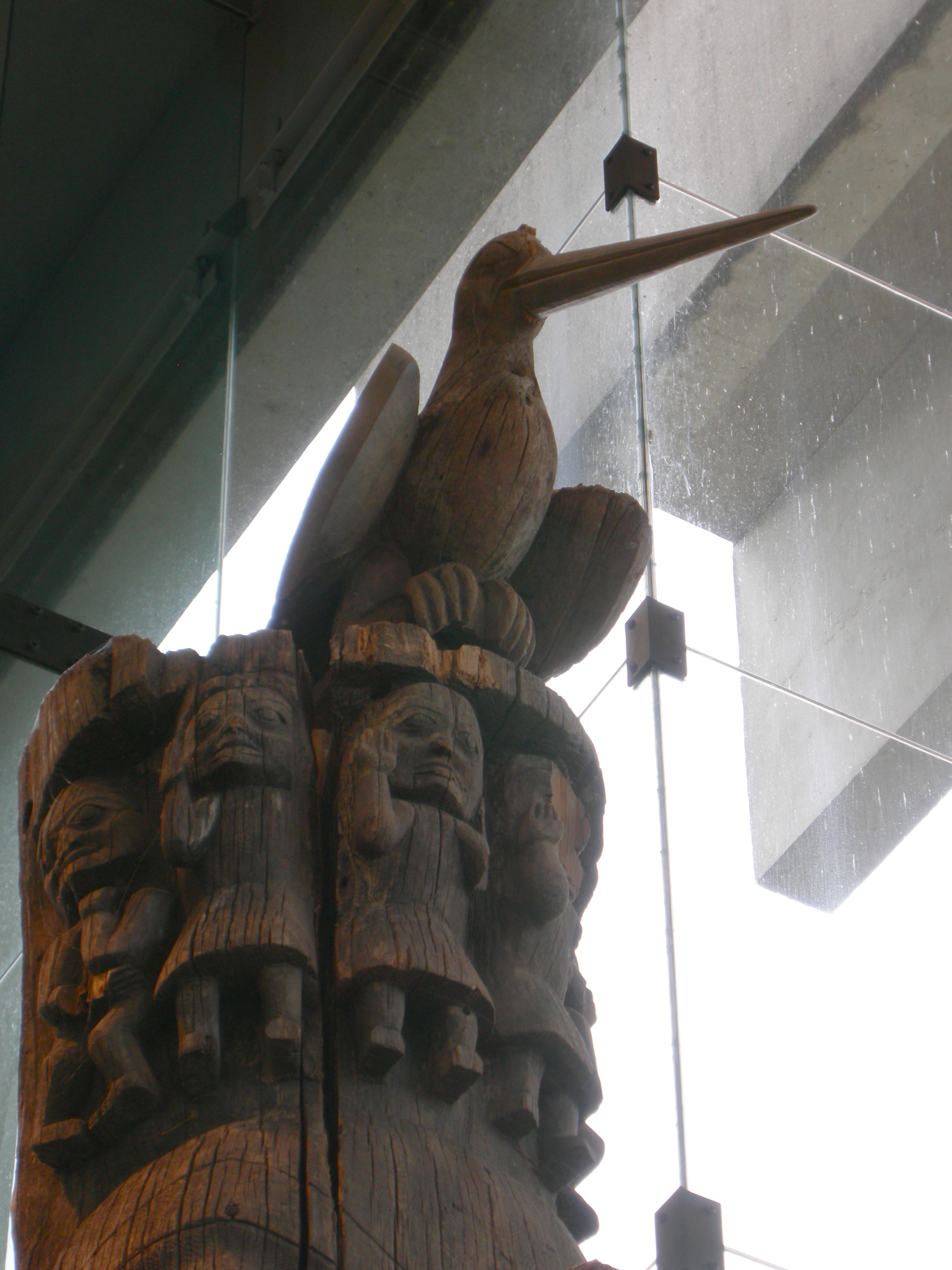 bird at the top of a story pole