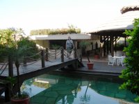 Cynthia on the neat little bridge over the hotel swimming pool.