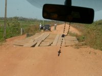crossing a somewhat rickety wooden bridge, first of 126