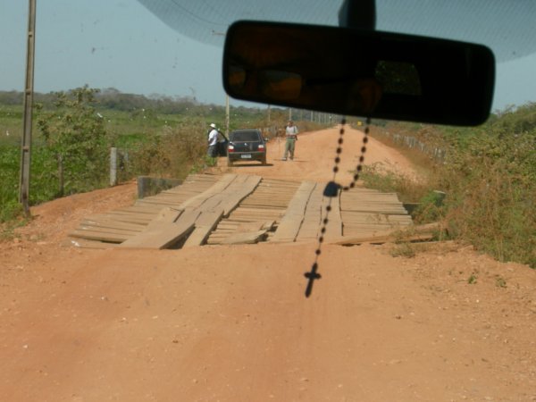 crossing a somewhat rickety wooden bridge, first of 126