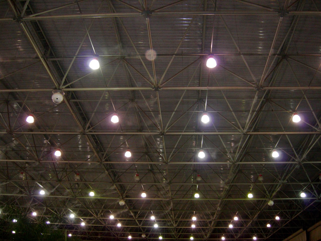 very high, warehouse-like ceiling, with misting jets