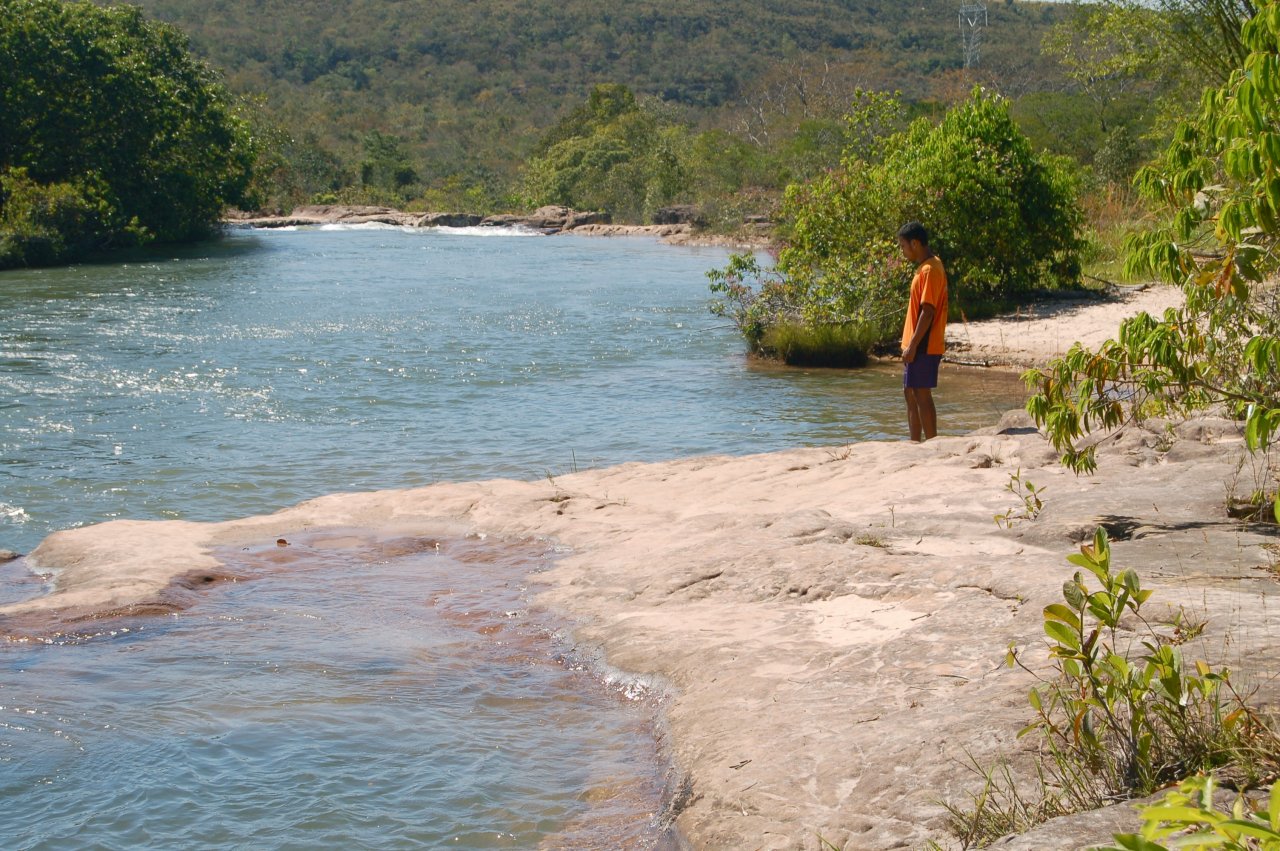 a guide waiting on the side of the river