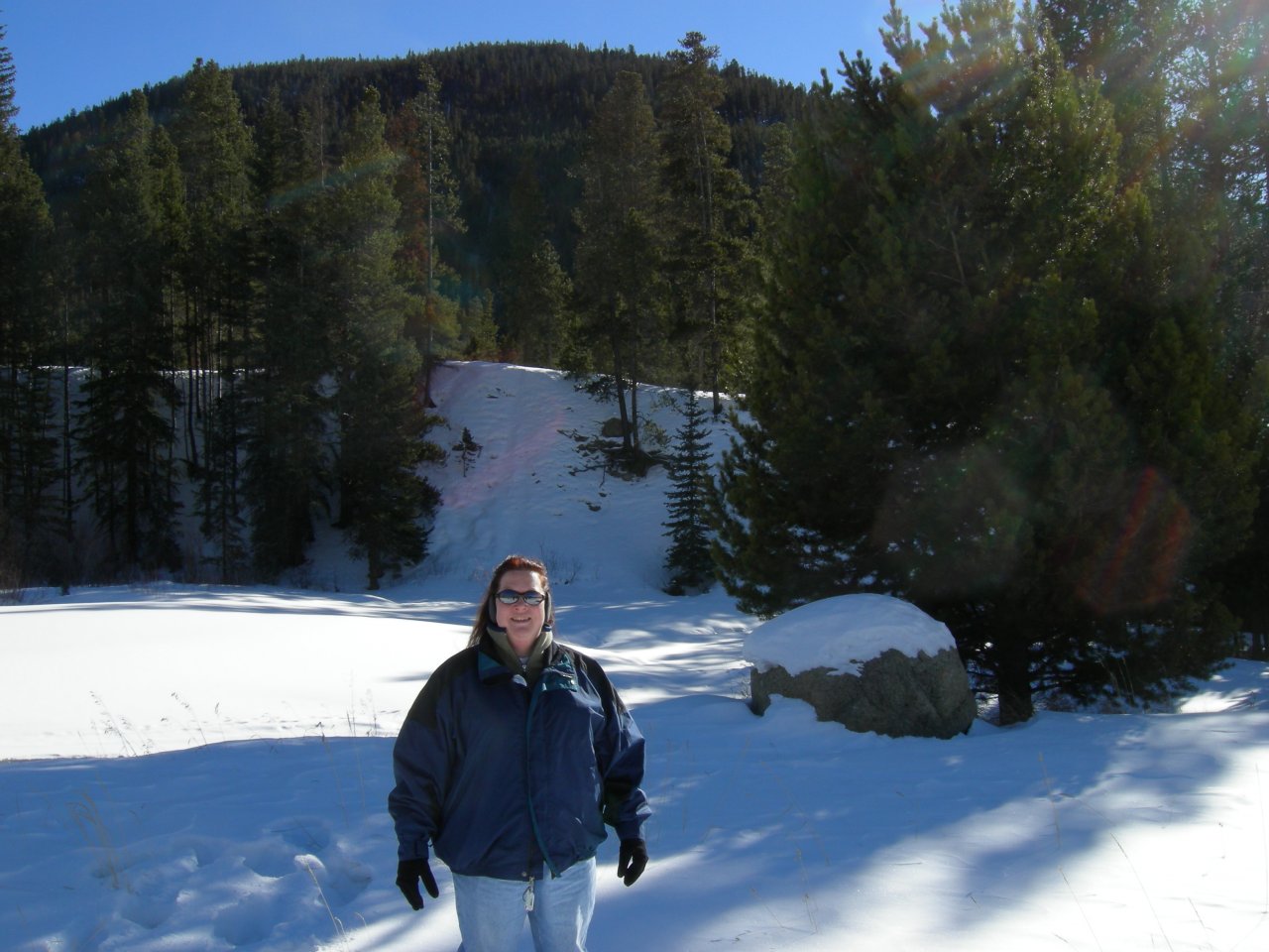 Cynthia posing in front of the mountain