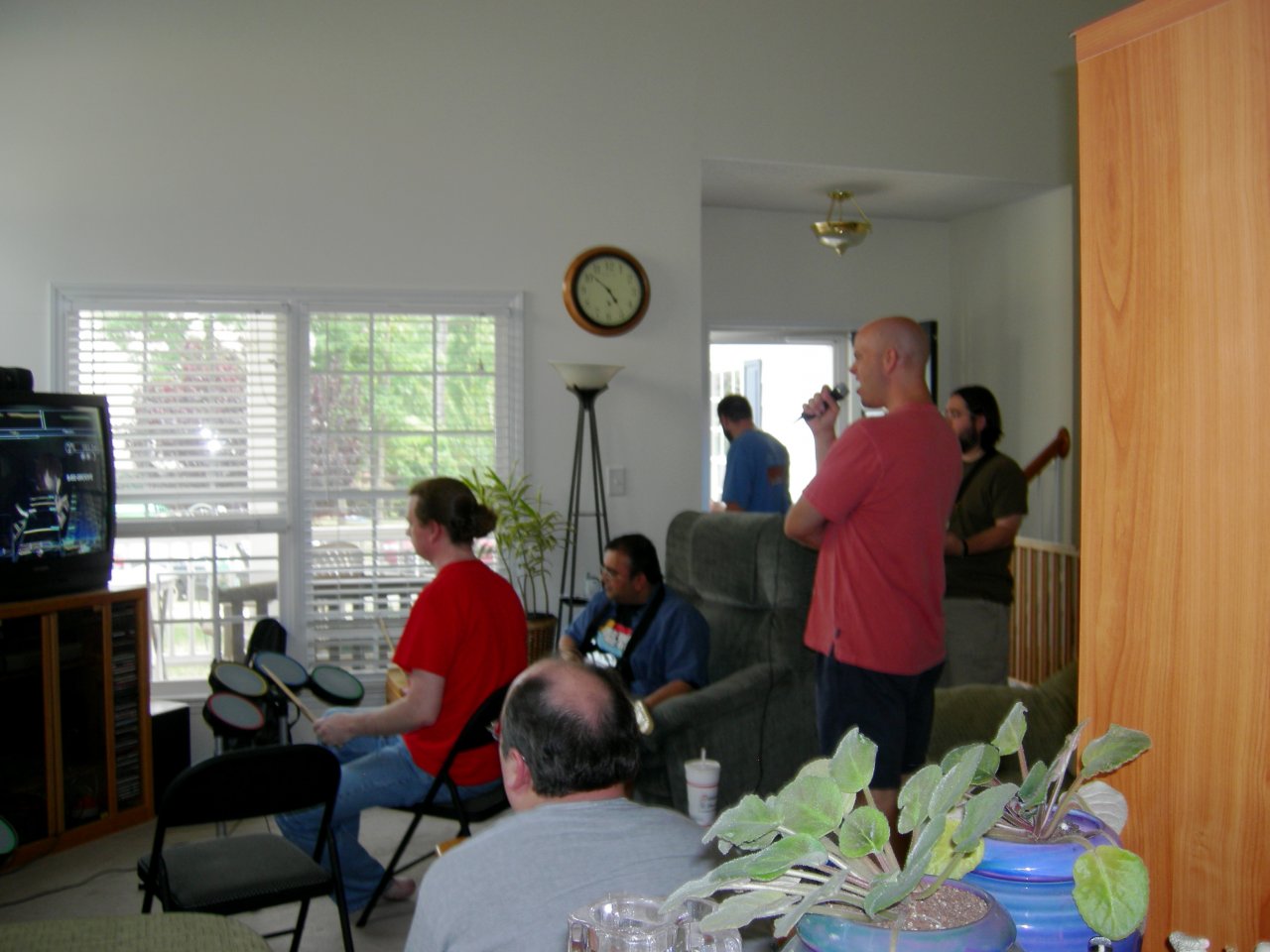 BadMojo, Kurrelgyre, Coldforged, and Ranger Rick playing Rock Band.