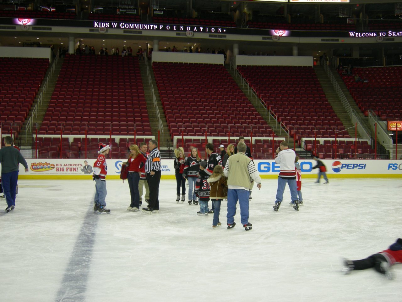 a big group of folks congregating in the center of the ice