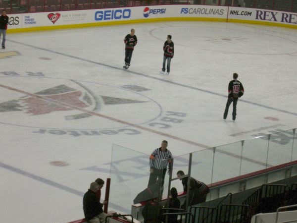 Pitkanen, Leighton, and Sutter (Ron the Ref and Seidenberg in the foreground)