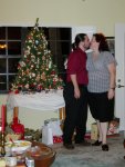 Ben and Cynthia kissing by the tree