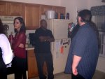 (Cynthia's arm), Holly, Jeff, Shep, and Chris hanging out in the kitchen