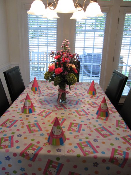 the table, with Cynthia's flower arrangement