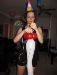 Courtney putting the one-eyed snake balloon in the "flower" balloon
