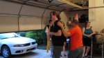 Cam hitting the piñata