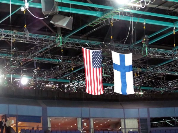 American and Finnish flags hanging from the ceiling