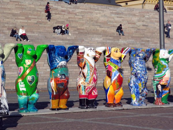 A line of Buddy Bears in front of the church steps.