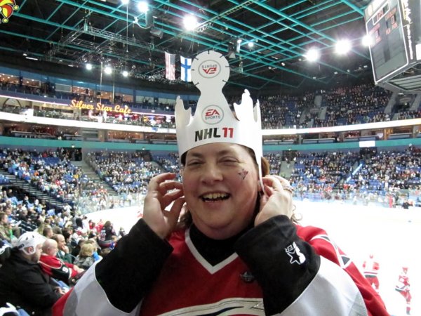 Cynthia trying on her NHL 11 helmet as a crown