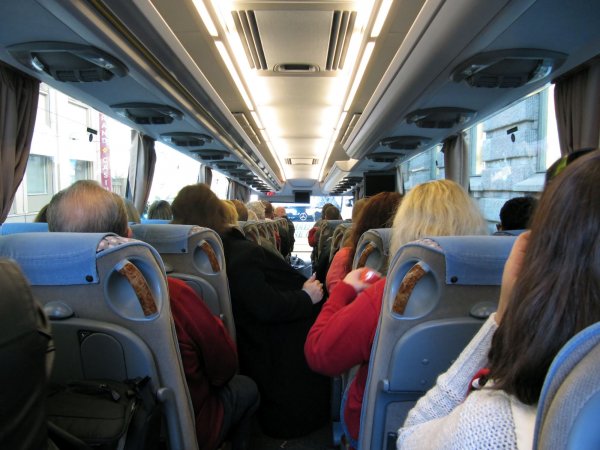 On the green bus heading to Hartwall Areena.  Green bus is the most punctual bus!  ;)