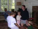 15. Scott, Stephanie, Mike and Cameron Playing with the Rain Stick