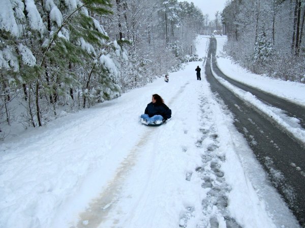 Cynthia going backwards down the snow hill