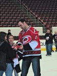Jay Harrison signing autographs on the ice