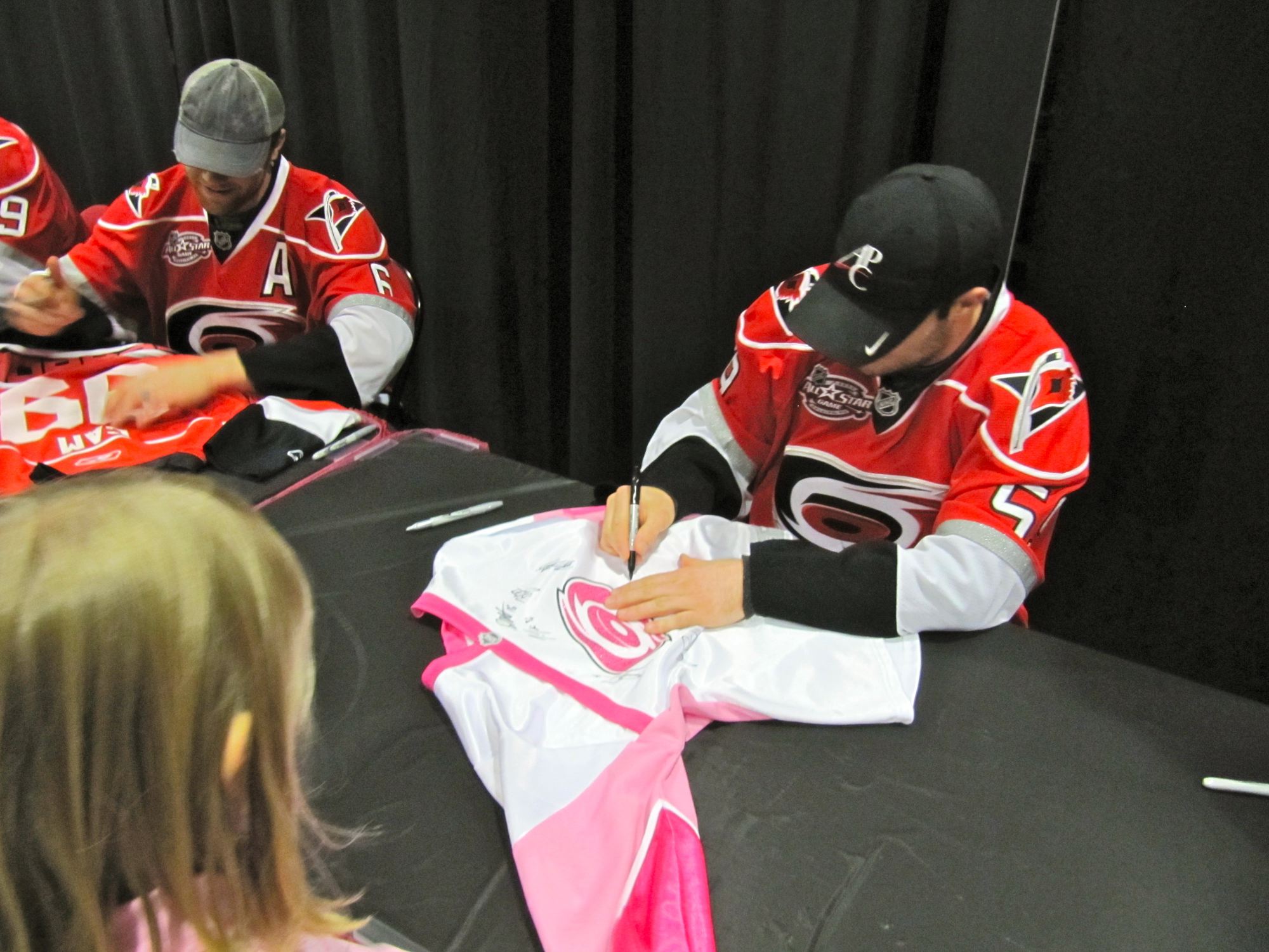 LaRose signing Stephanie's jersey