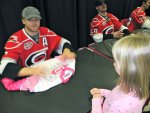 Gleason signing Stephanie's jersey