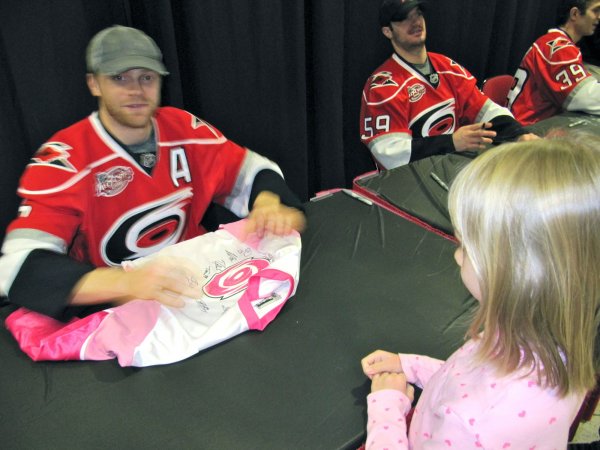 Gleason signing Stephanie's jersey