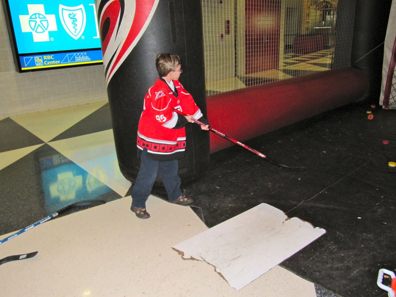 Cameron shooting a puck