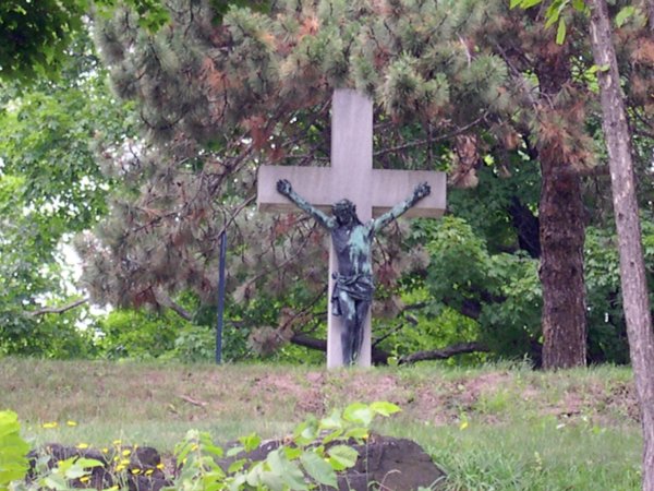 Cemetery - Crucifix tombstone on the hill.