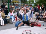 Quebec City - Looking for "strong men" to hold up his unicycle.