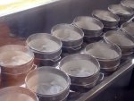 Closeup of the cheese press tins.