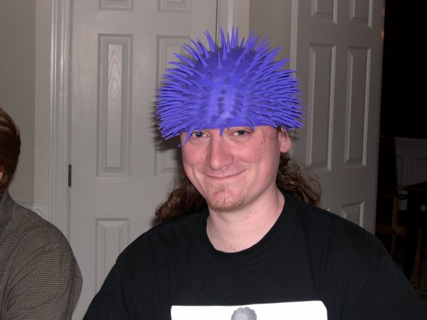 Cam wearing a spiky hat/stress-reliever