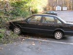 A further-back shot of his car