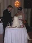 Jamie and Angie cutting the cake