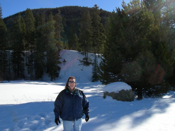 Cynthia posing in front of the mountain