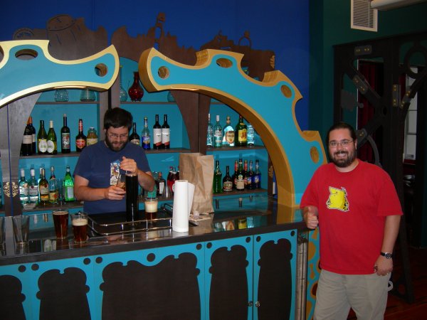 me posing at the bar (thumbs up!) with Landon still pouring beer  :)